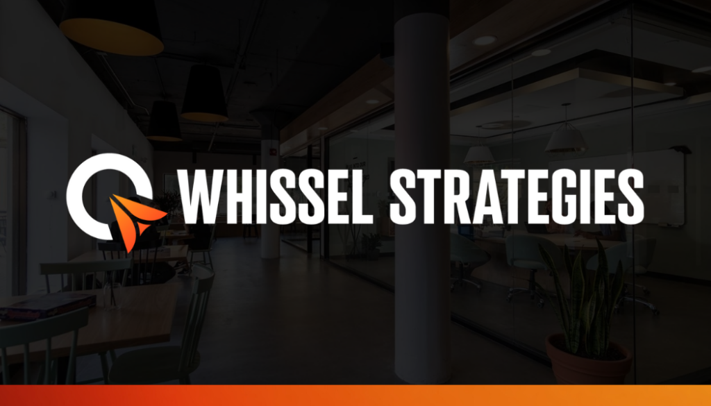 Whissel Strategies Logo for Whissel Strategies, a leading Toronto Marketing Agency, displayed over a modern office interior with glass walls, desks, chairs, and overhead lighting. Toronto Digital Marketing Agency