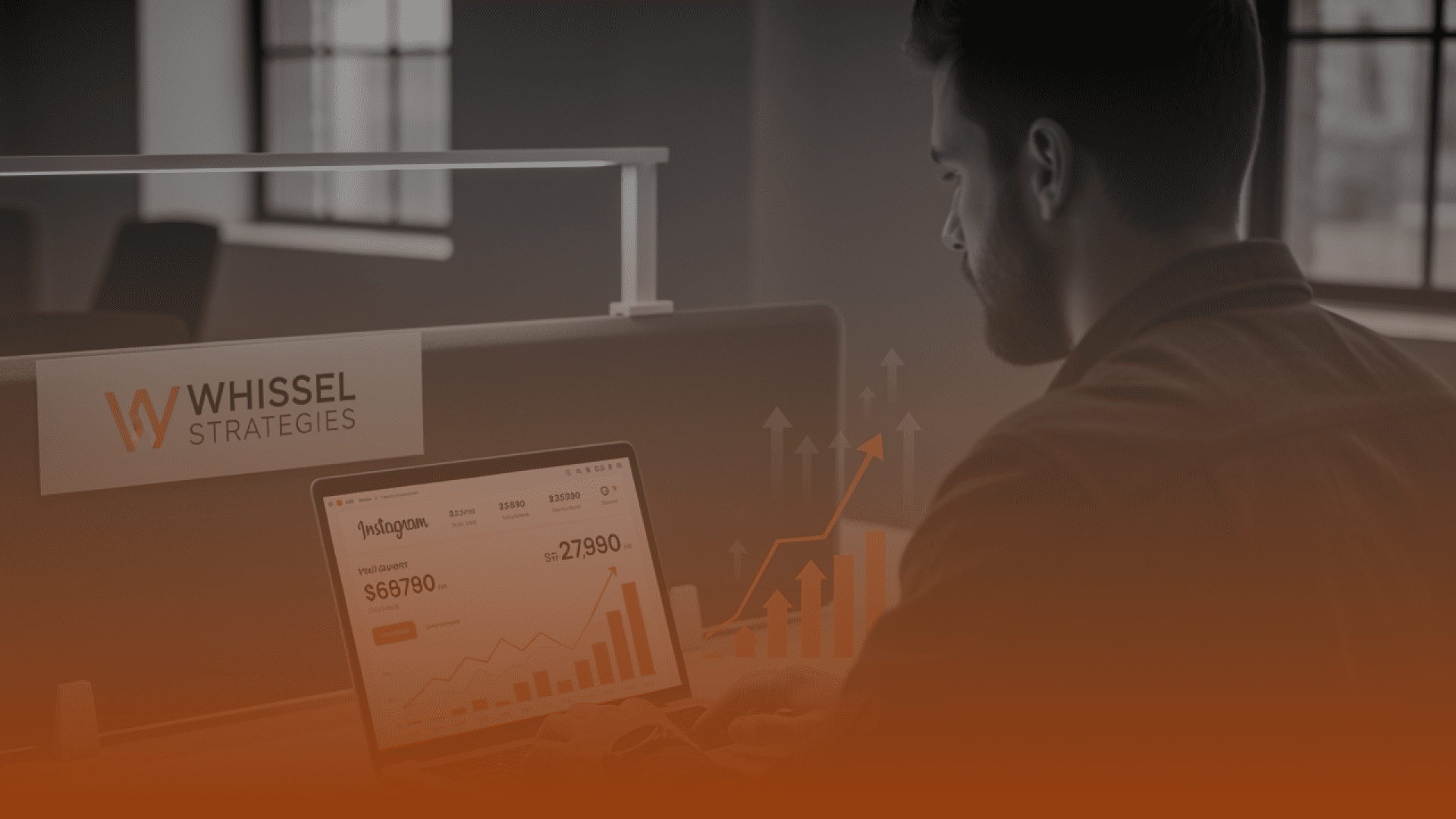 Whissel Strategies A man reviews digital marketing analytics on a laptop at a desk labeled "Whissel Strategies" in a modern office setting. Toronto Digital Marketing Agency