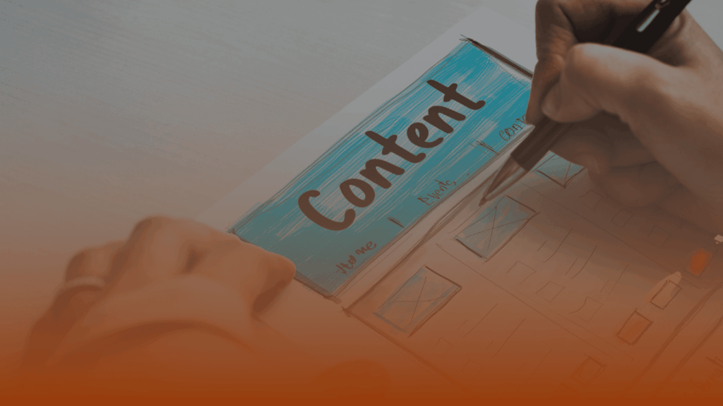 Whissel Strategies A person writes on a paper labeled "Content," with drawn sections and boxes, using a black pen on a white desk. Toronto Digital Marketing Agency
