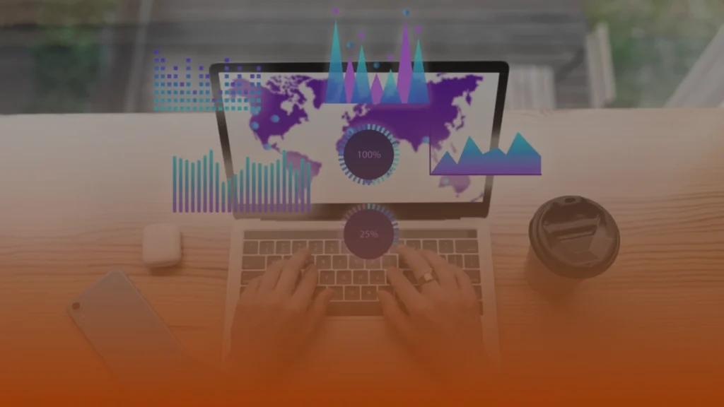 Whissel Strategies Hands typing on a laptop with a world map on the screen, overlaid with digital charts and graphs; coffee cup and phone nearby. Toronto Digital Marketing Agency