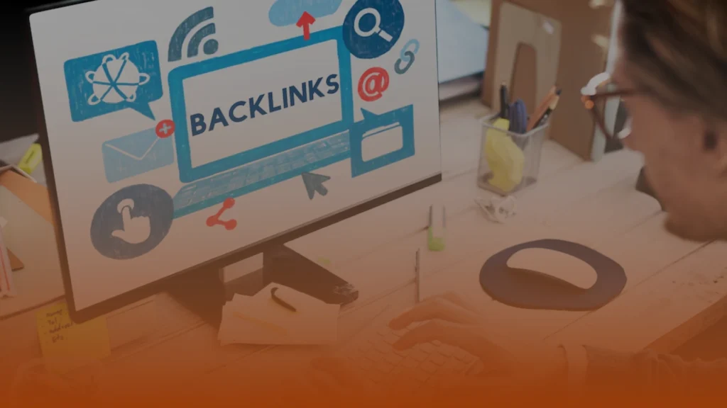 Whissel Strategies Person working at a desk with a computer screen displaying the word "Backlinks" and various digital marketing icons. Toronto Digital Marketing Agency