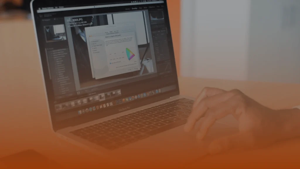 Business professionals reviewing lead generation performance data on a laptop