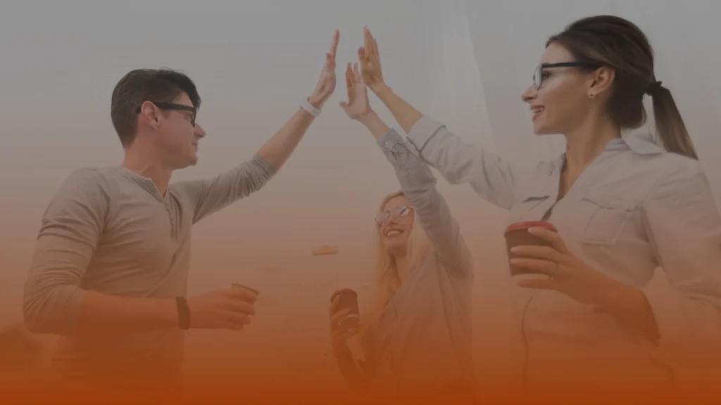 SEO professionals celebrating successful collaboration and project results