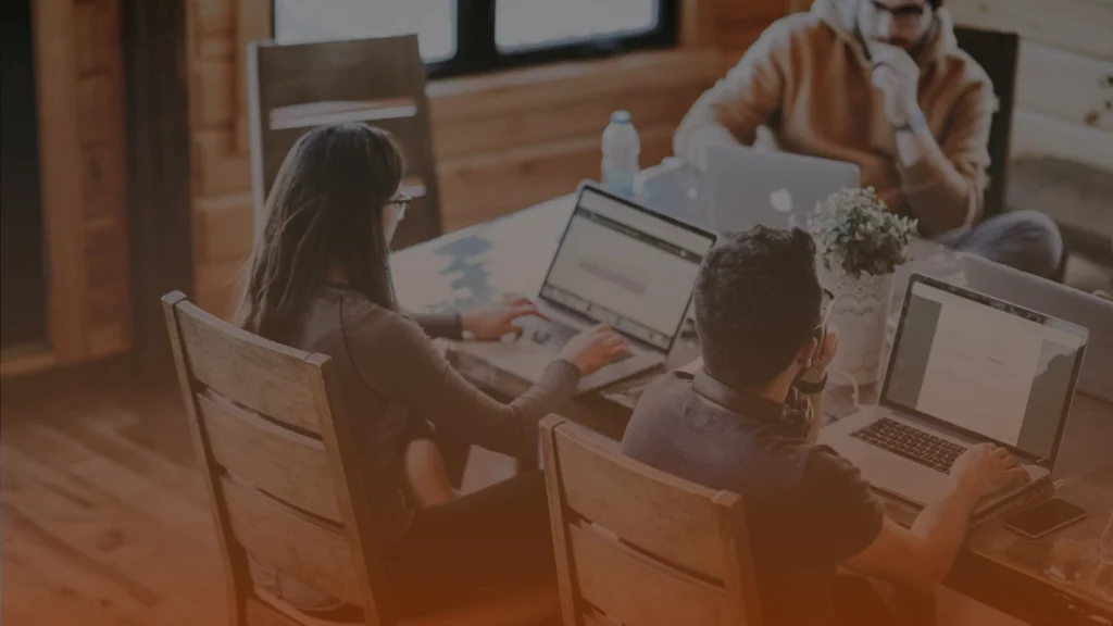 Toronto SEO consultants discussing B2B and B2C SEO strategies during a team meeting
